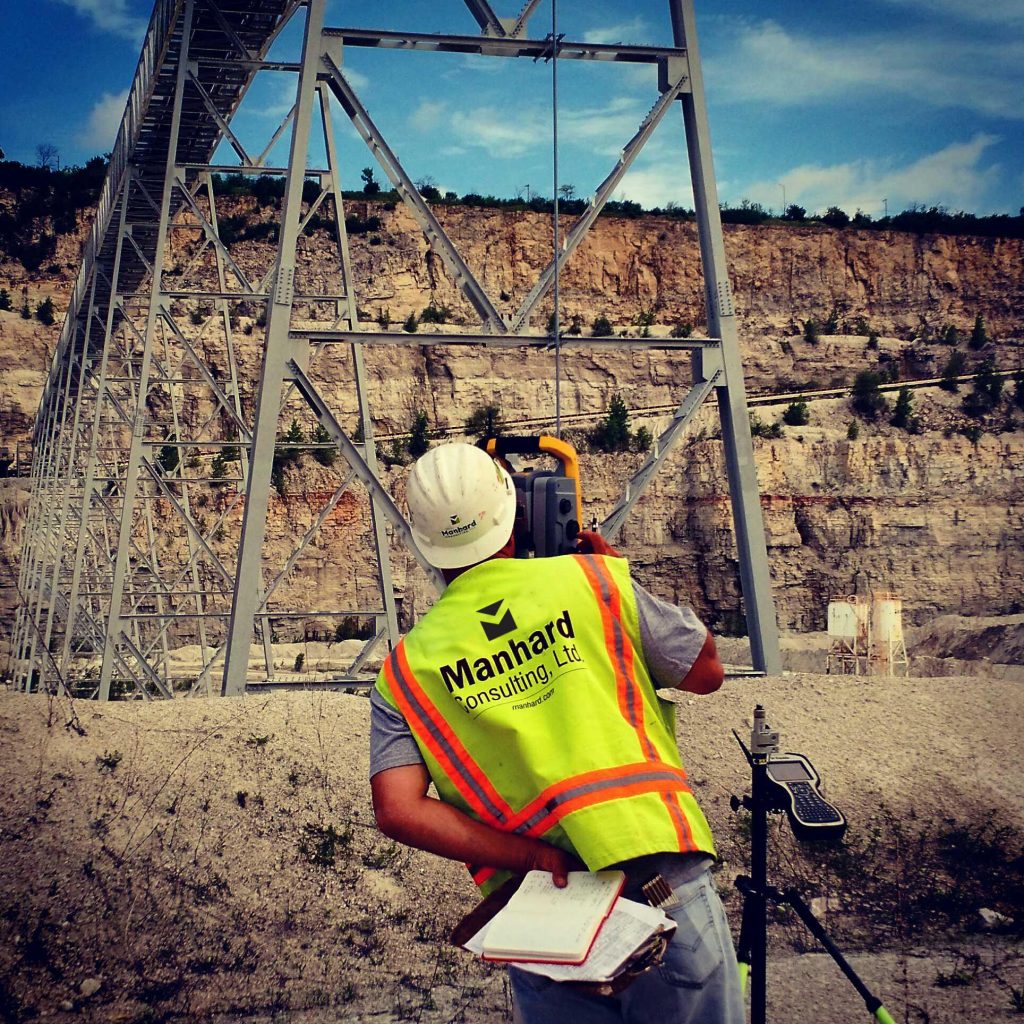 manhard surveyor in field